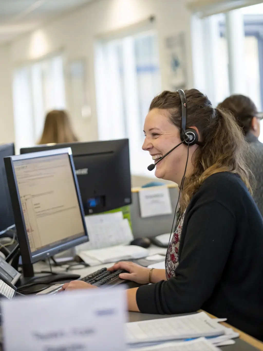 An image of a Phone Systems Atlanta support team member assisting a client over the phone, highlighting reliable support.