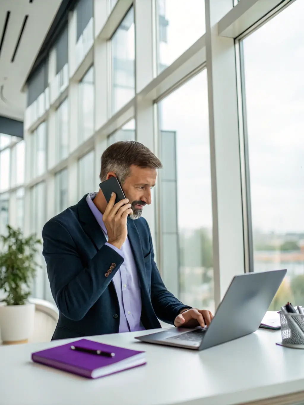 A person using a mobile phone in a business setting, integrated with the cloud phone system, demonstrating the ability to manage calls and communications on the go.