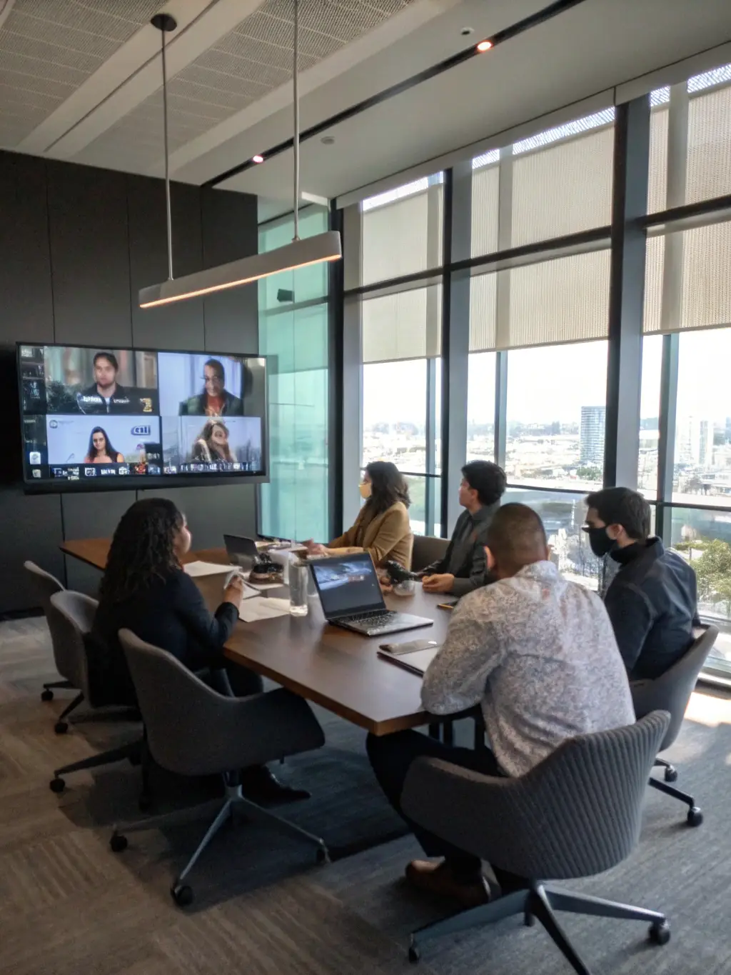 A team collaborating seamlessly on a mobile device using Zultys MX, accessing call transcripts and summaries on the go.